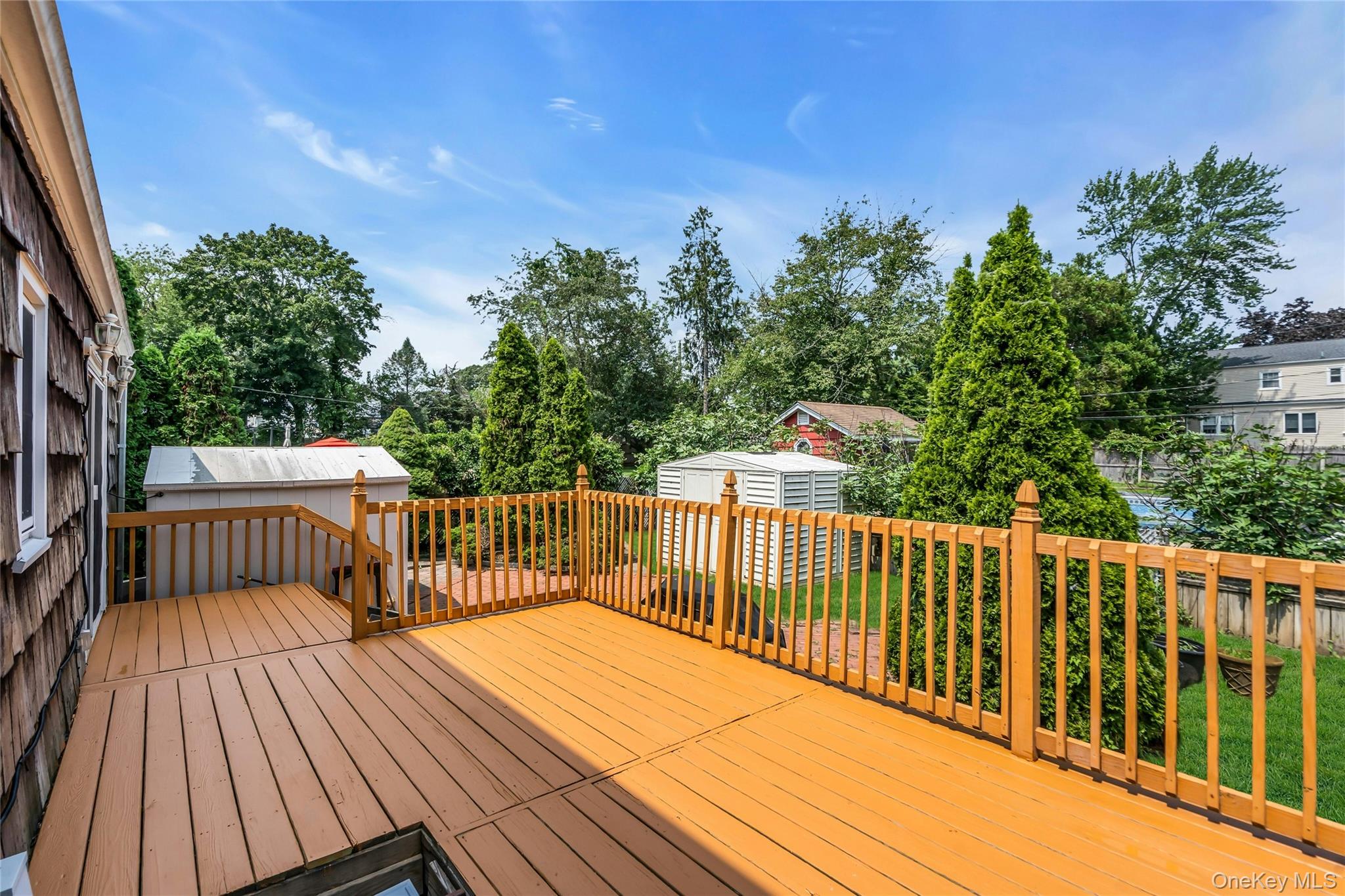 639 Townline Road Hauppauge, NY 11788 - Photo 26 of 28 a view of a wooden deck with a trees