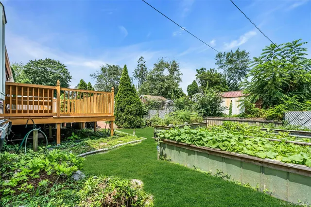 a view of a backyard with sitting area
