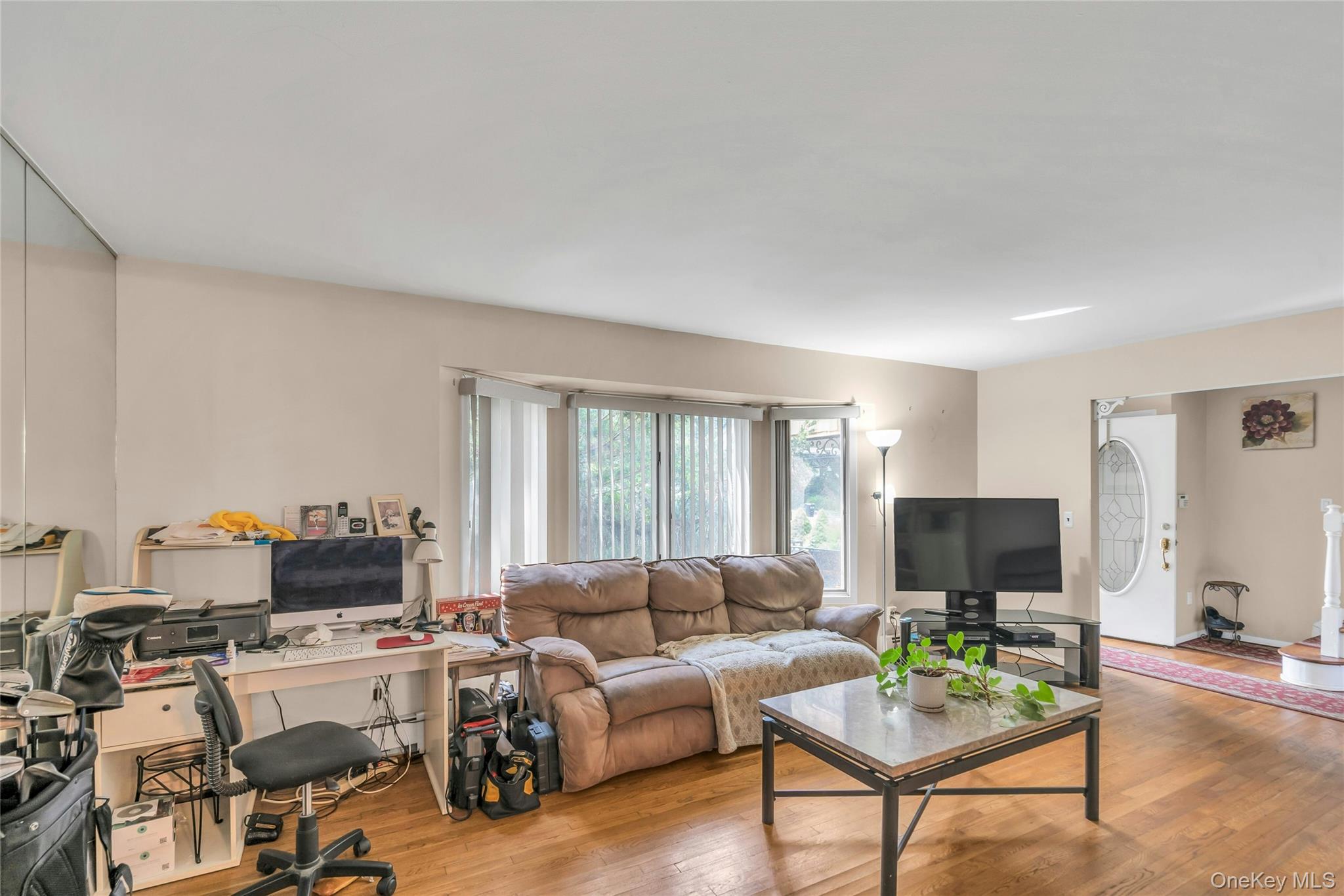 639 Townline Road Hauppauge, NY 11788 - Photo 7 of 28 a living room with furniture and a flat screen tv