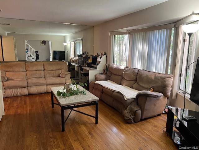 639 Townline Road Hauppauge, NY 11788 - Photo 8 of 28 a living room with furniture and a wooden floor
