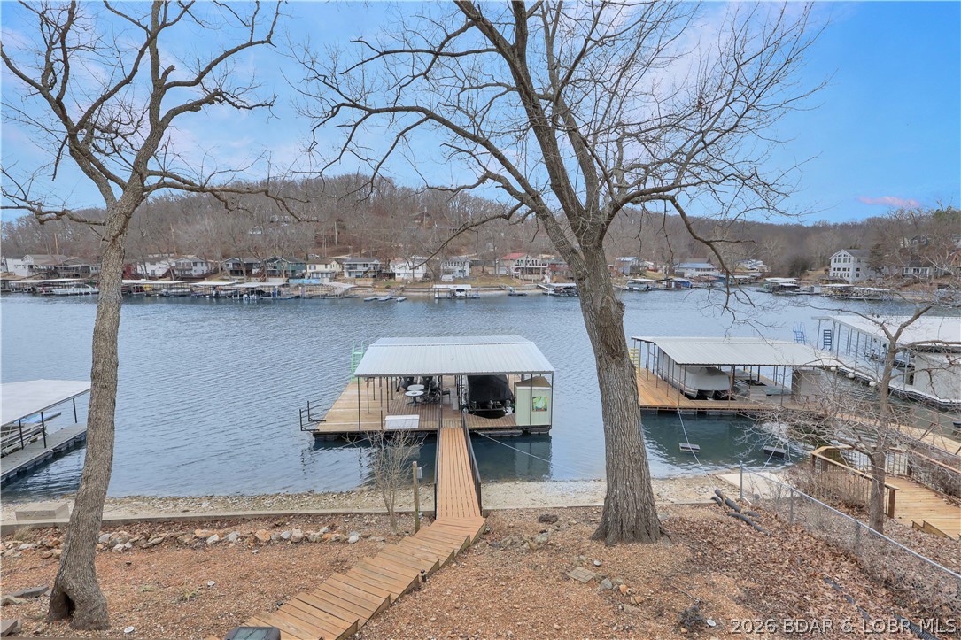 29966 Oak Knoll Road Rocky Mount, MO 65072 - Photo 44 of 68 Dock features an attached swim dock, 12x36 slip wi