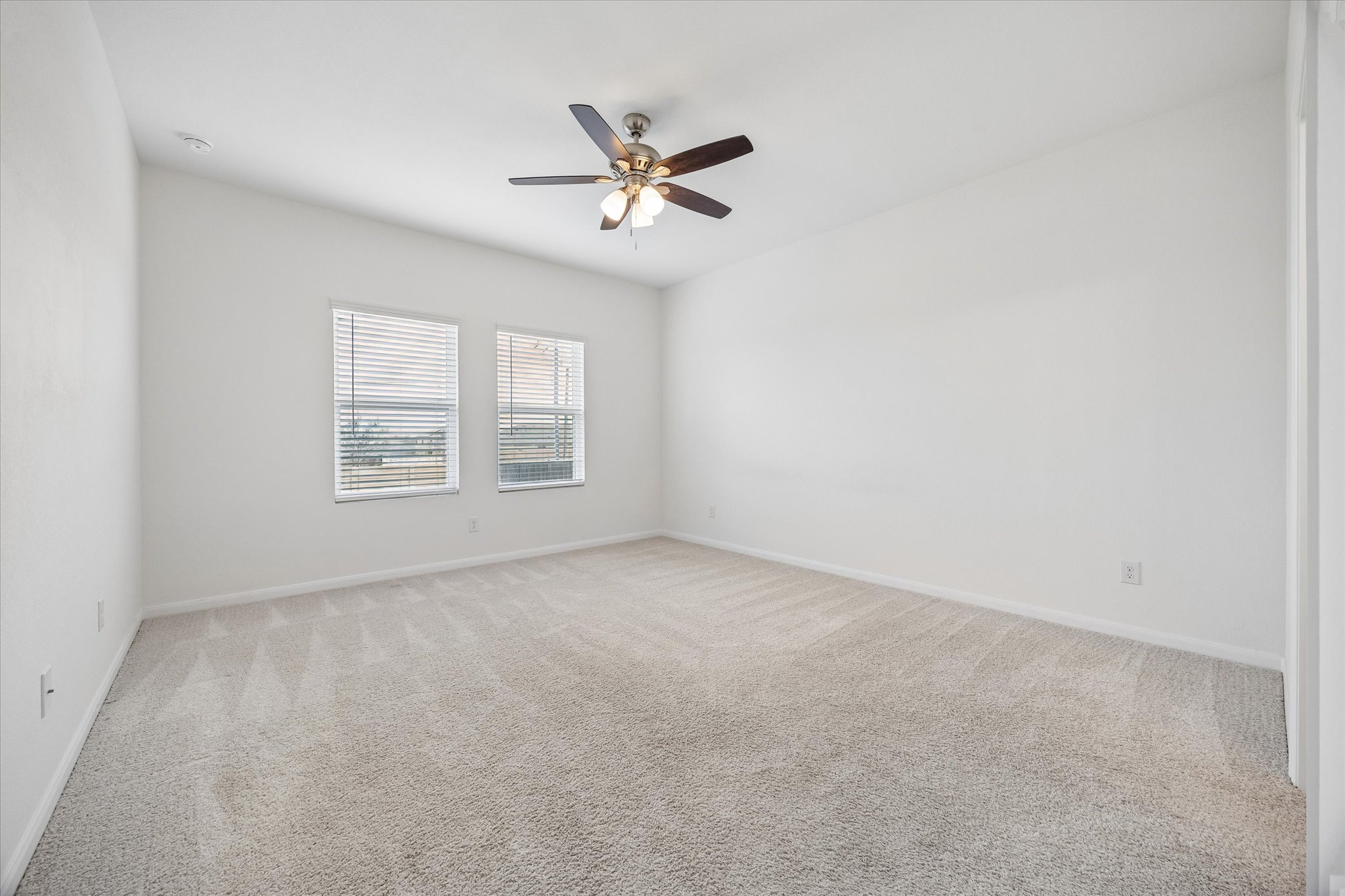 157 LT Rusty Drive Jarrell, TX 76537 - Photo 13 of 39 Empty room with light carpet and a ceiling fan