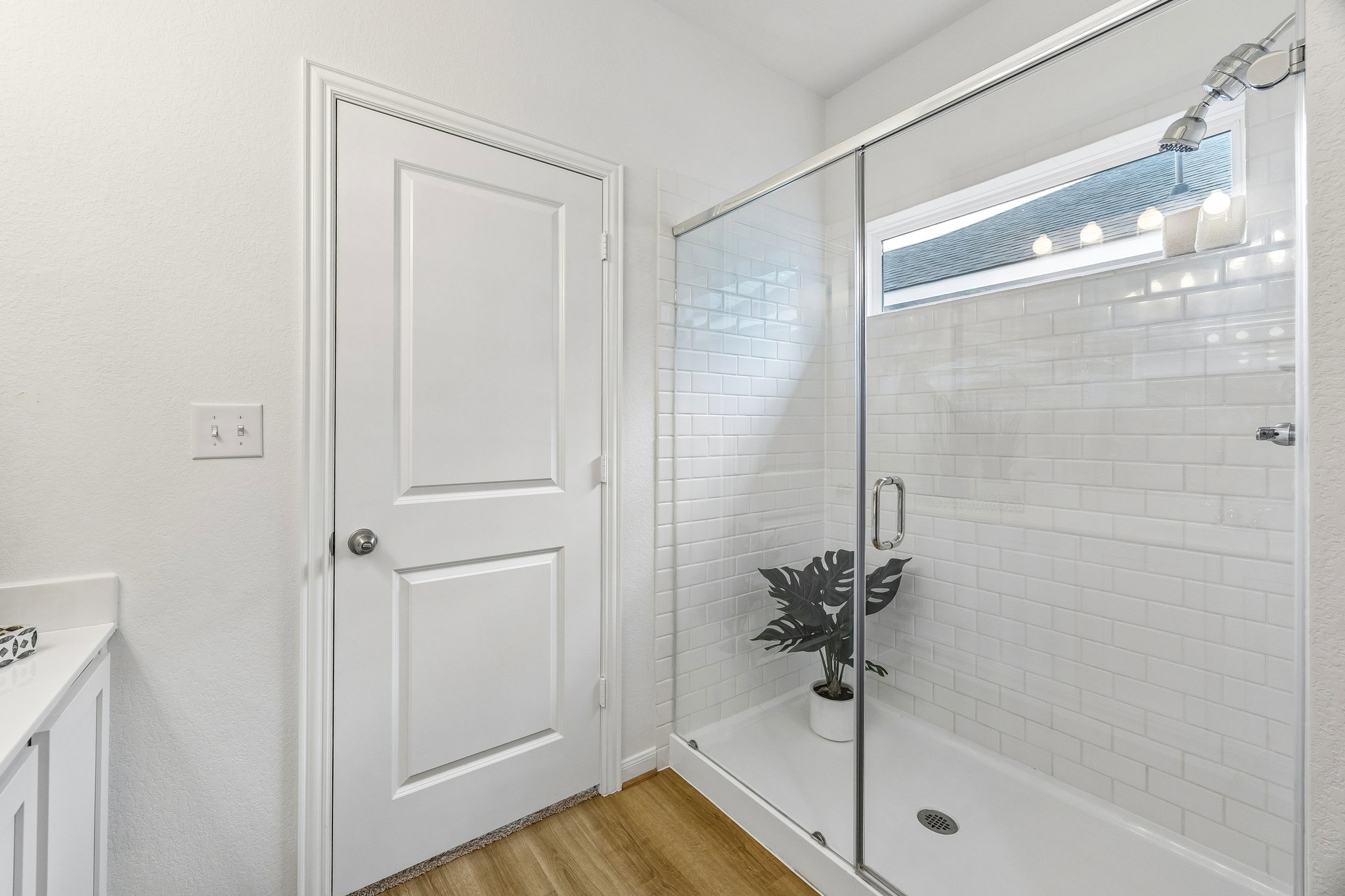 157 LT Rusty Drive Jarrell, TX 76537 - Photo 16 of 39 Bathroom with vanity, light wood-style floors, and a shower stall