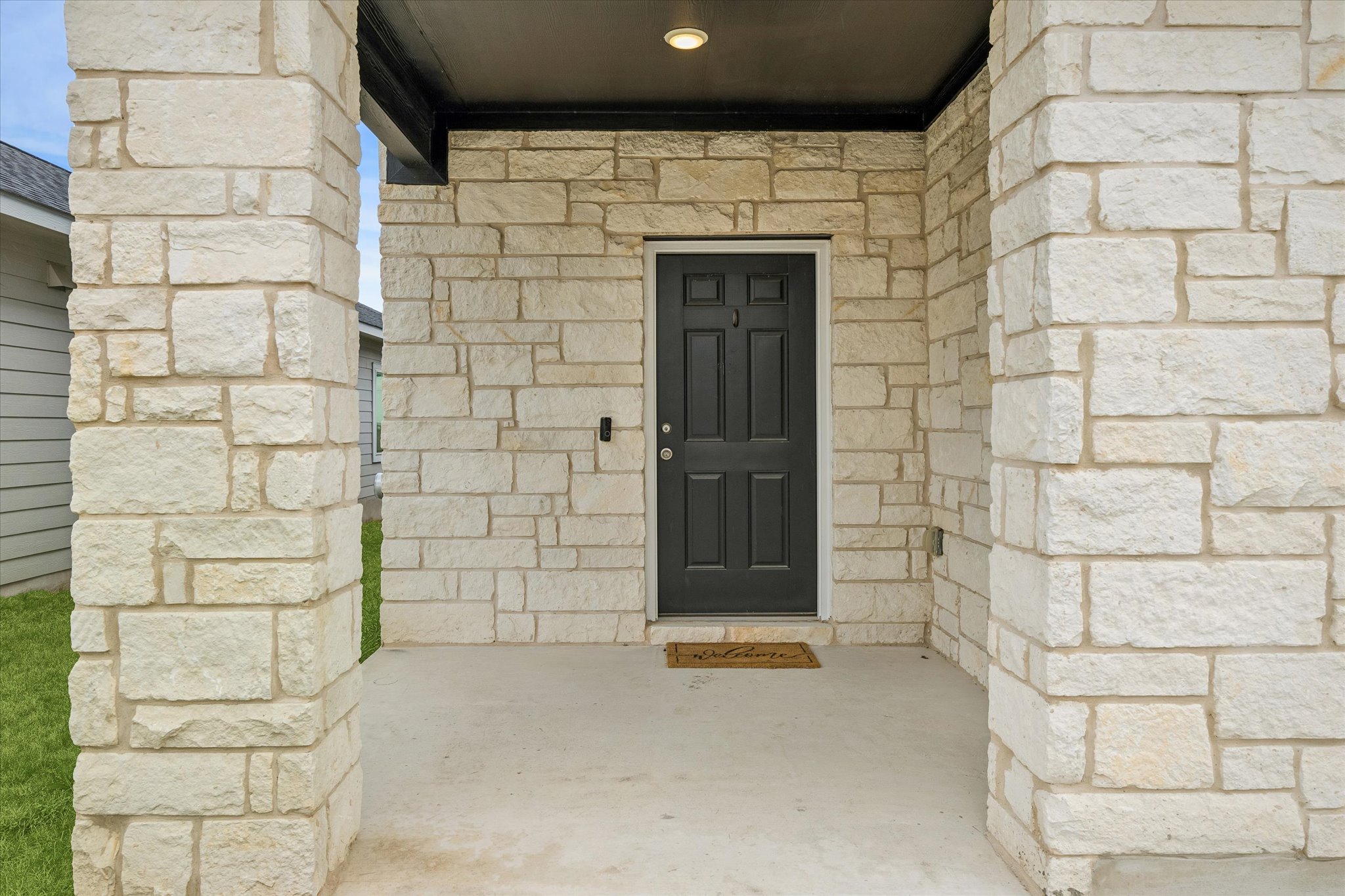 157 LT Rusty Drive Jarrell, TX 76537 - Photo 2 of 39 Entrance to property featuring stone siding