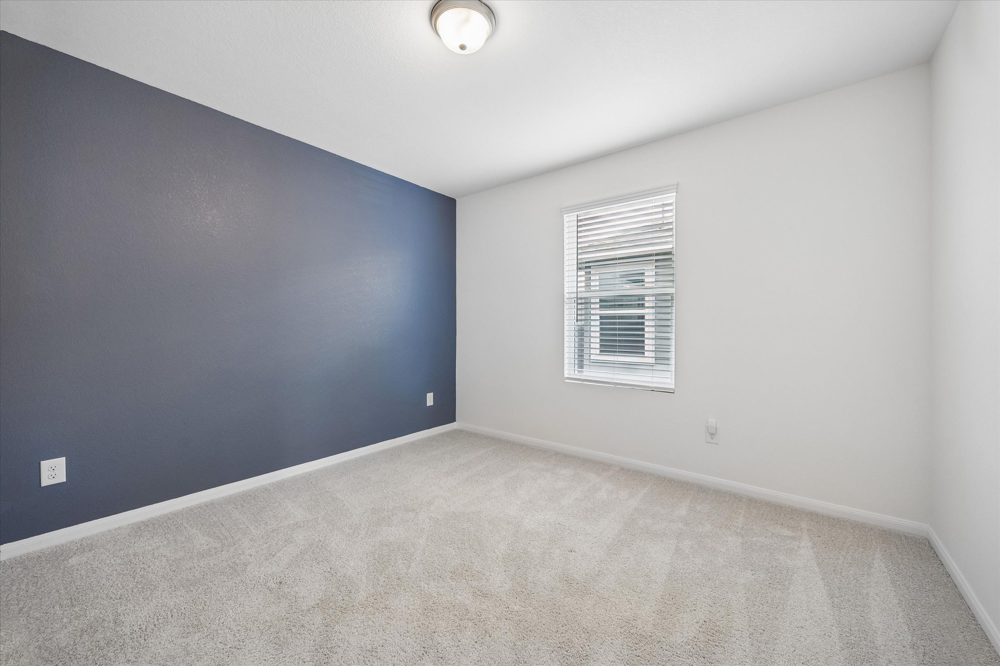 157 LT Rusty Drive Jarrell, TX 76537 - Photo 26 of 39 Empty room with light carpet and baseboards