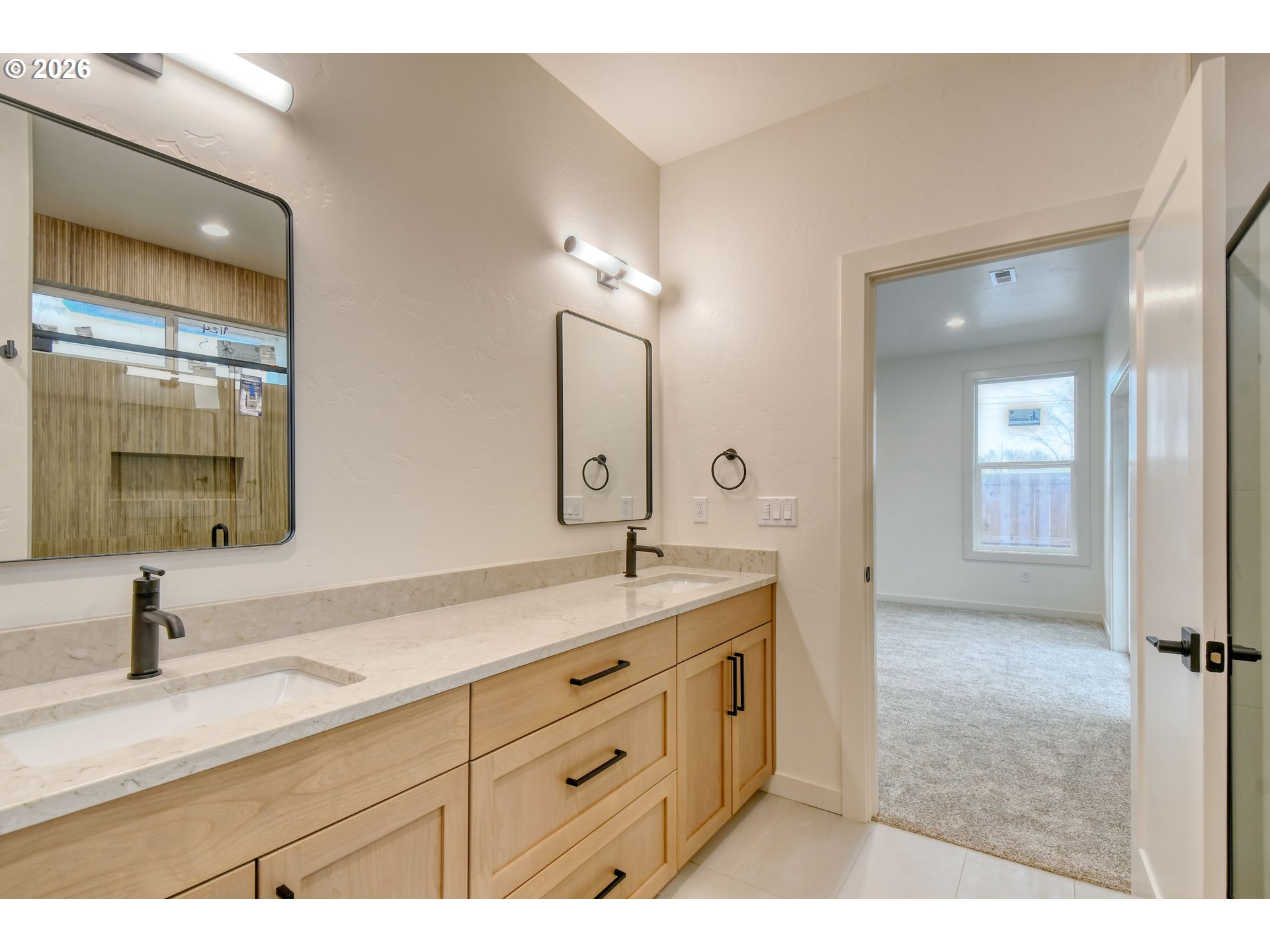 904 Southwest 43rd Street Pendleton, OR 97801 - Photo 25 of 46 a bathroom with a sink double vanity and mirror
