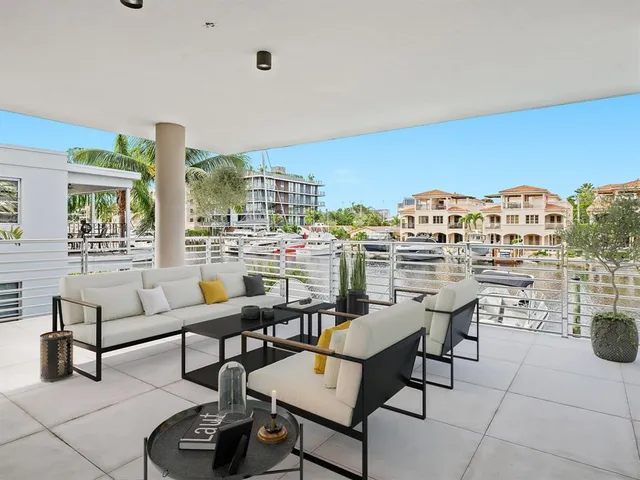 a view of a livingroom with furniture and a book shelf