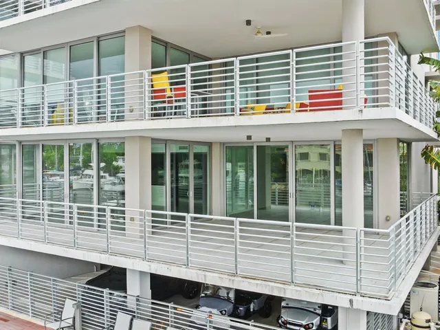 an aerial view of multiple houses with yard