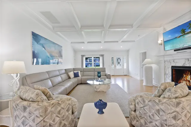 a living room with furniture fireplace and flat screen tv