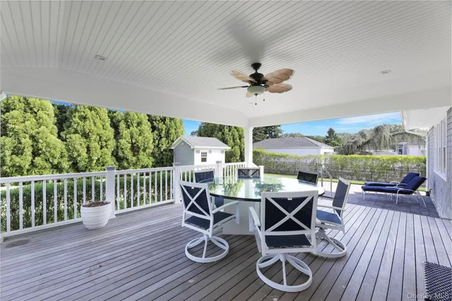 a view of a patio with table and chairs
