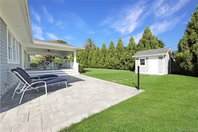 a patio with table and chairs