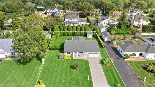 an aerial view of a house with a garden