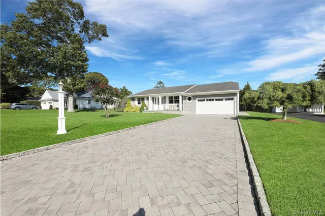 a view of house with a yard