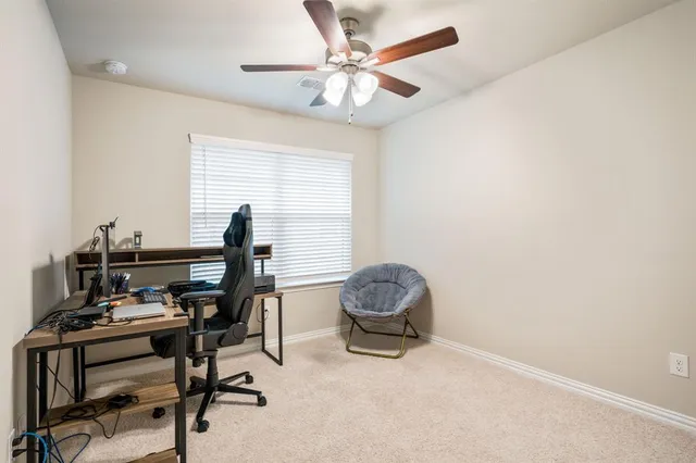 a workspace with furniture and a window