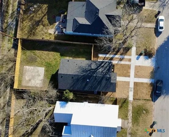 a view of house with a yard