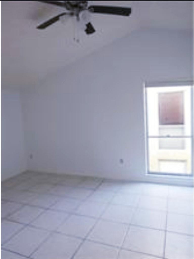 8401 West Sample Road, Unit 21 Coral Springs, FL 33065 - Photo 4 of 6 a view of an empty room with a window