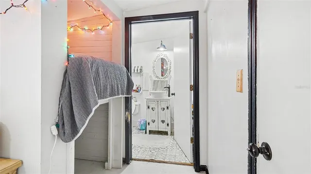 a view of a hallway with windows and entryway