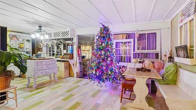 a living room filled with furniture and a chandelier