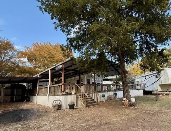 a view of a house with a tree