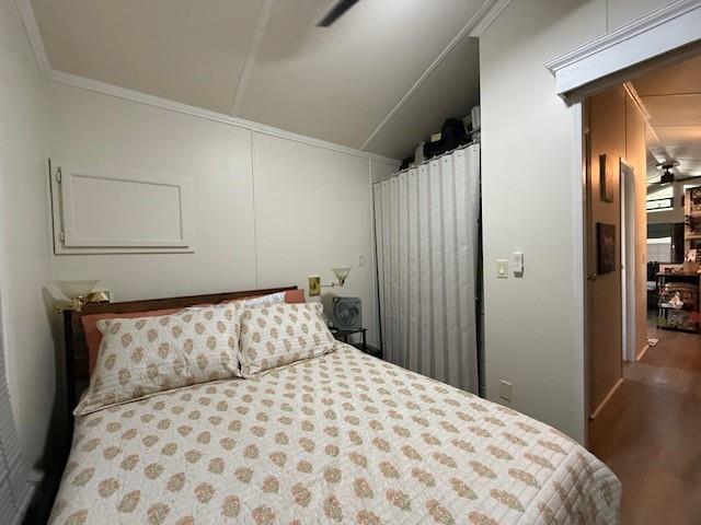 6435 FM 17 Yantis, TX 75497 - Photo 12 of 22 a bedroom with a large bed and wooden floor