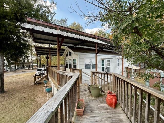 6435 FM 17 Yantis, TX 75497 - Photo 13 of 22 a view of a roof deck with wooden floor and fence