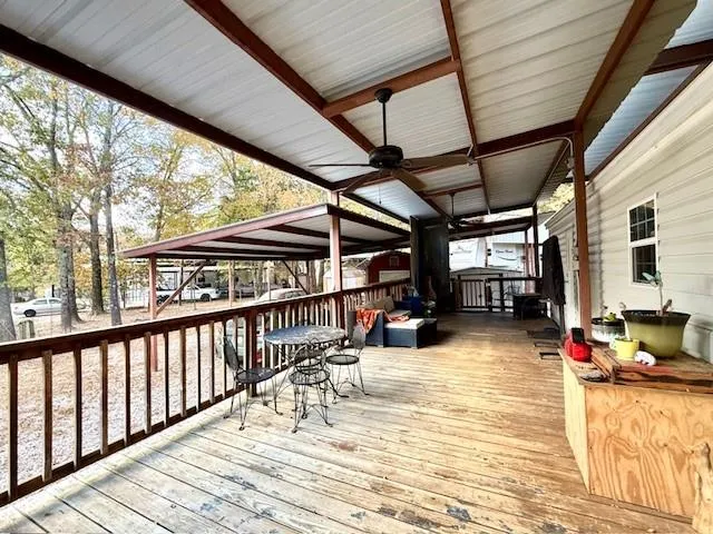 a view of a patio with wooden floor