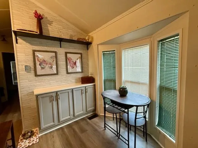 a dining room with furniture and window