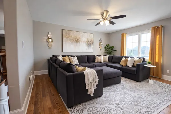 a living room with furniture and a flat screen tv