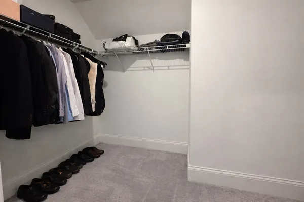 a white toilet sitting next to a bath tub