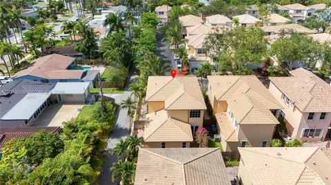 an aerial view of residential houses with city view