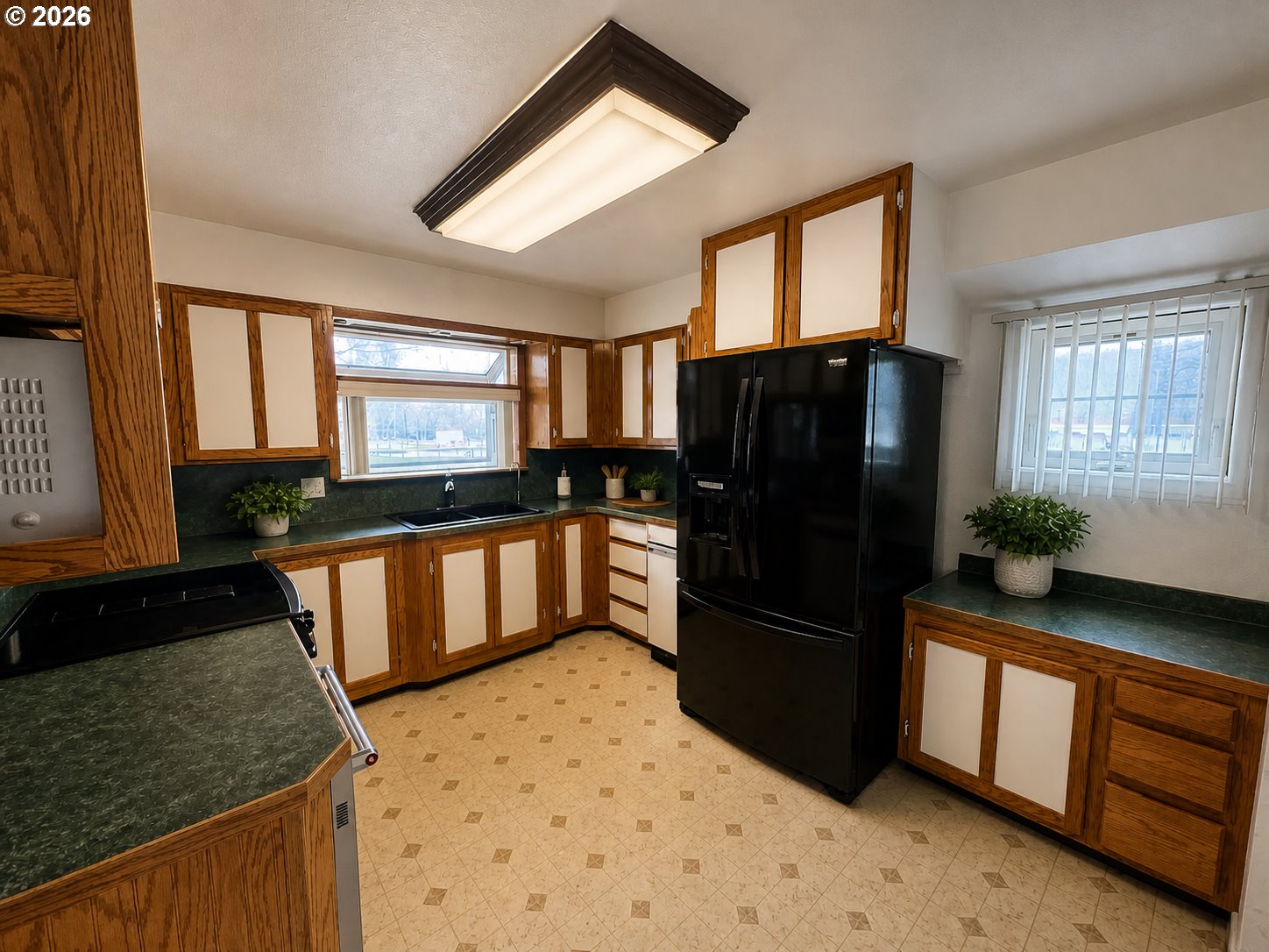 1920 Cliff Street Baker City, OR 97814 - Photo 11 of 34 a kitchen with granite countertop a refrigerator stove and sink