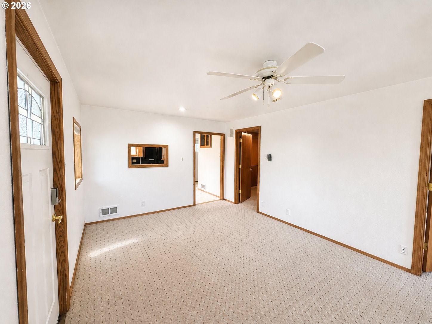 1920 Cliff Street Baker City, OR 97814 - Photo 2 of 34 an empty room with ceiling fan and window