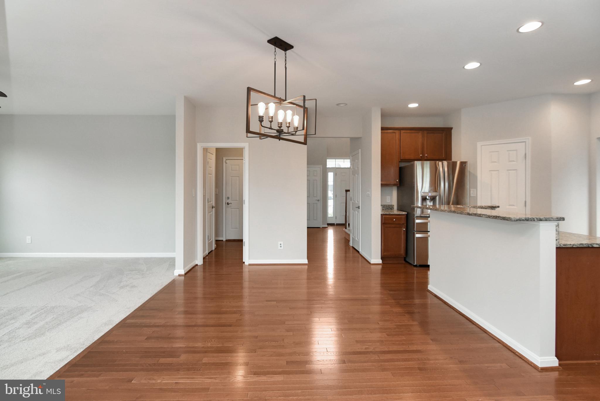 5329 Longbow Road King George, VA 22485 - Photo 18 of 43 Living Room/Kitchen View with Hardwood Floors