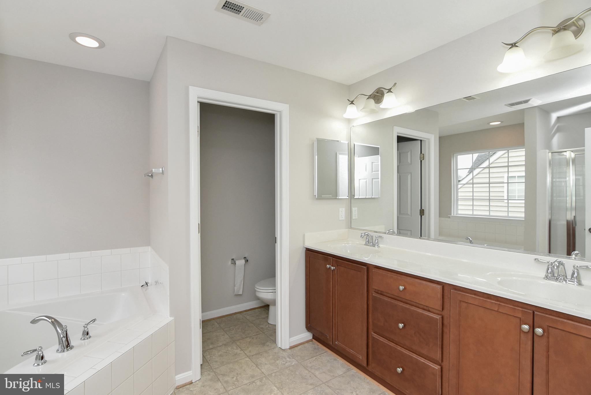 5329 Longbow Road King George, VA 22485 - Photo 28 of 43 Primary Bathroom with Double Vanity & Bath Tub