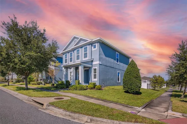 a city view with tall buildings and a yard