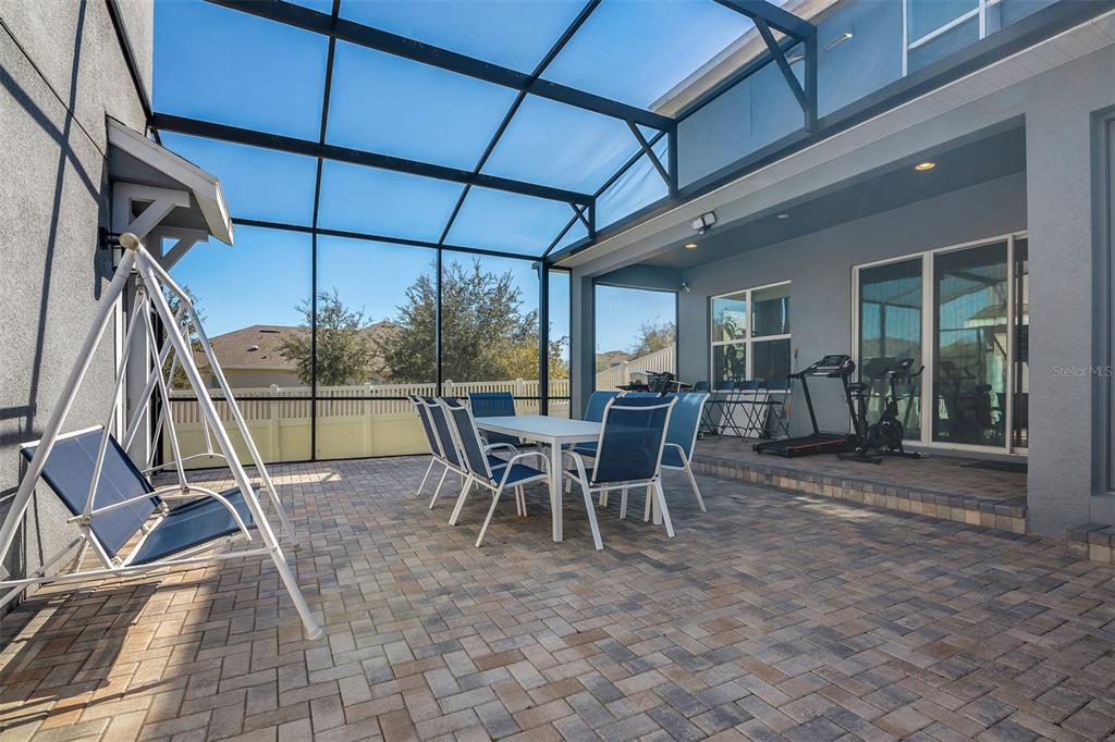 15807 Sweet Lemon Way Winter Garden, FL 34787 - Photo 13 of 35 a view of a dining room with furniture and floor to ceiling window
