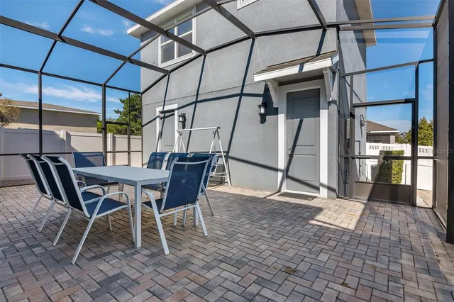 a view of a dining space with a table and chairs