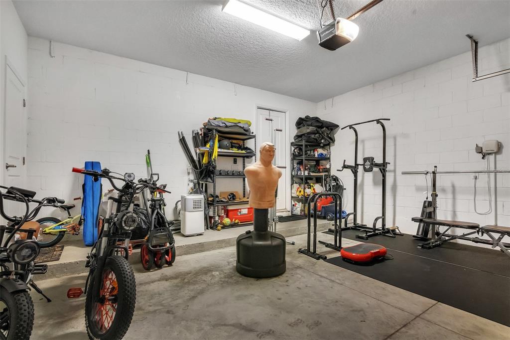 15807 Sweet Lemon Way Winter Garden, FL 34787 - Photo 16 of 35 a view of a room with gym equipment