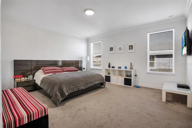 a bedroom with bed and a window