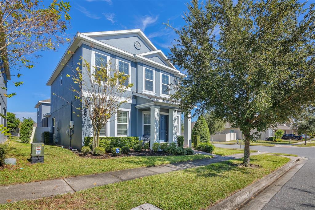 15807 Sweet Lemon Way Winter Garden, FL 34787 - Photo 3 of 35 a front view of a house with garden