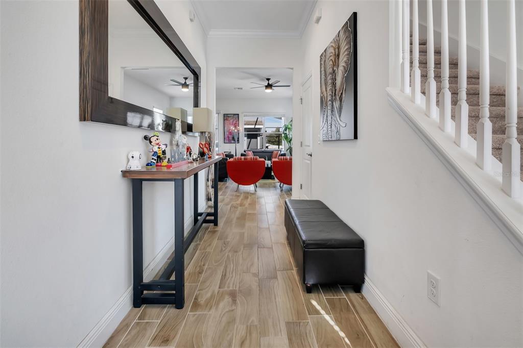 15807 Sweet Lemon Way Winter Garden, FL 34787 - Photo 6 of 35 a living room with furniture and a wooden floor