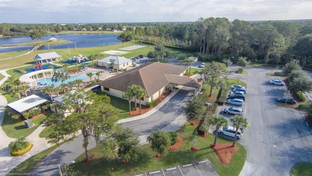 8649 Primavera Street Sebring, FL 33872 - Photo 10 of 20 an aerial view of a house with a lake view