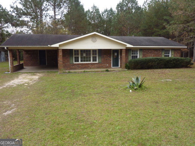44 Hinson Farm Road Hazlehurst, GA 31539 - Photo 1 of 1 a front view of a house with a yard