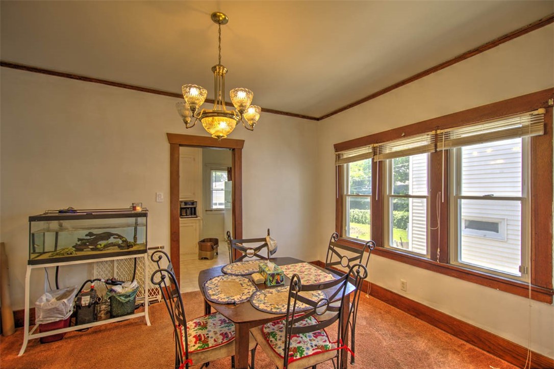 739 West Cushing Street Decatur, IL 62526 - Photo 11 of 28 a dining room with chandelier fan and wooden floor