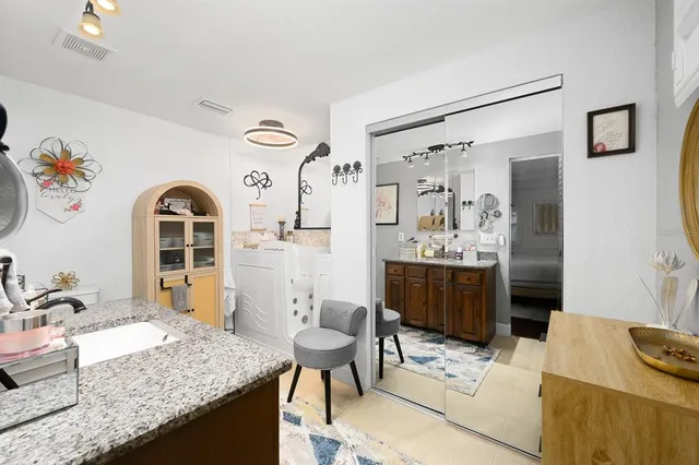 a living room with granite countertop furniture and fireplace