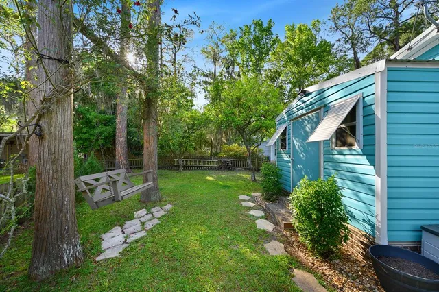 a view of a park with large trees