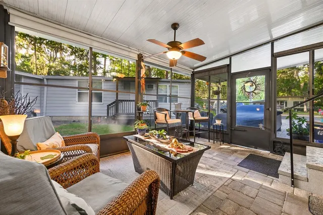 a outdoor space with patio the couches and a dining table with garden view