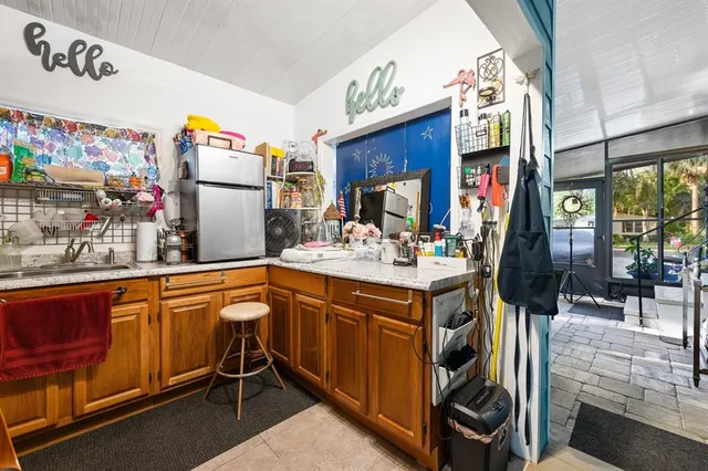 a kitchen that has a sink and a stove