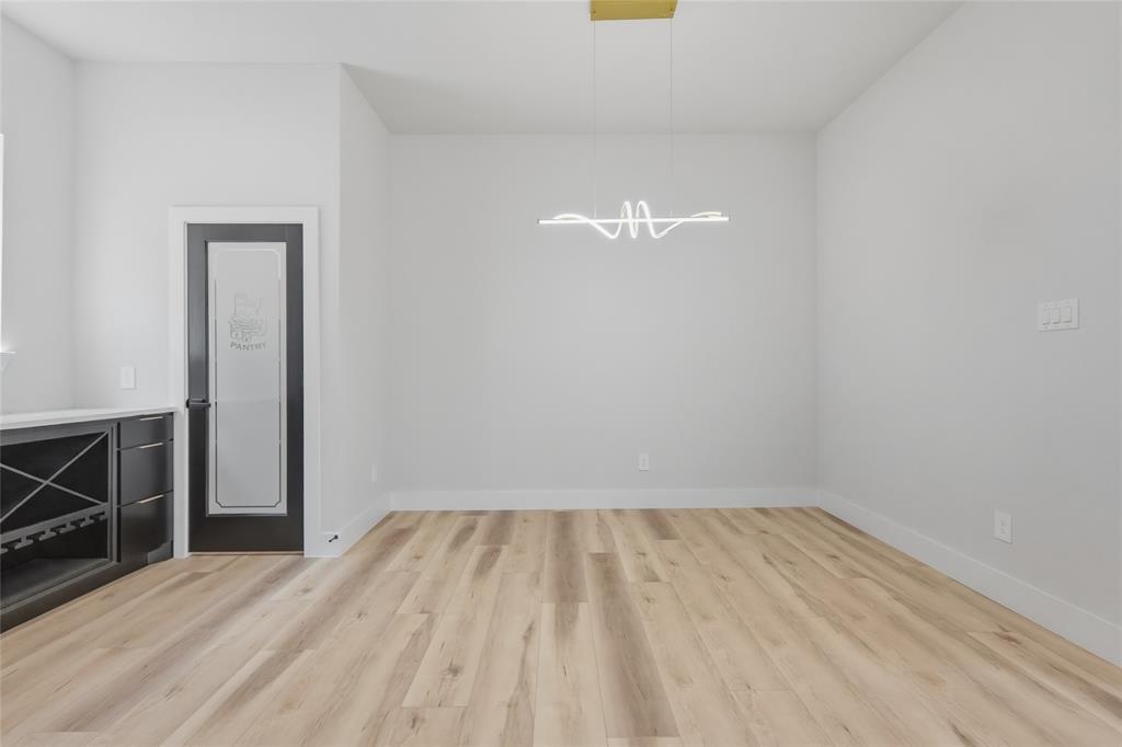 3914 Harlingen Street Dallas, TX 75212 - Photo 3 of 28 a view of empty room with wooden floor