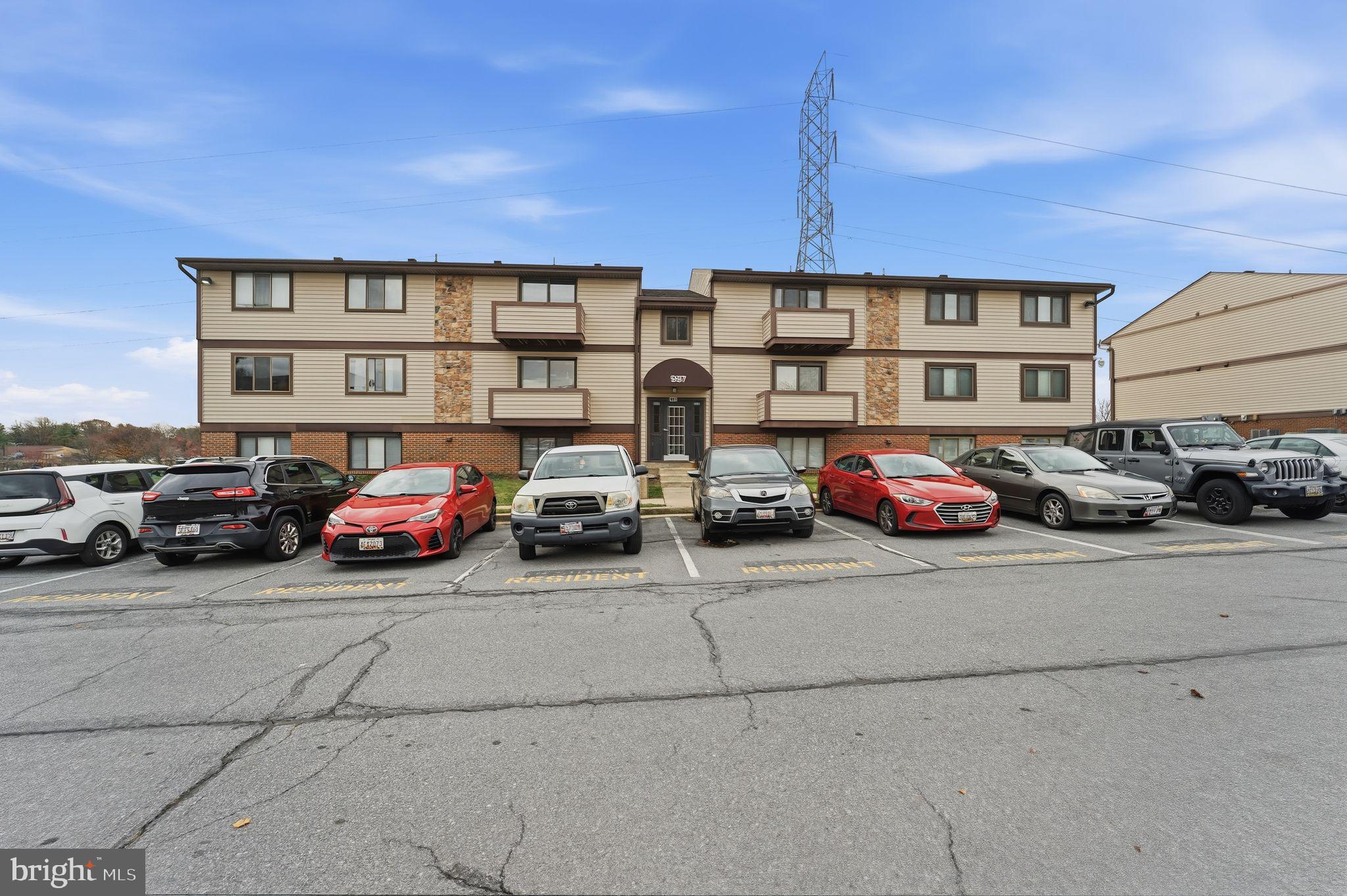 997 Heather Ridge Drive, Unit 3G Frederick, MD 21702 - Photo 13 of 14 a view of a cars parked in front of a house